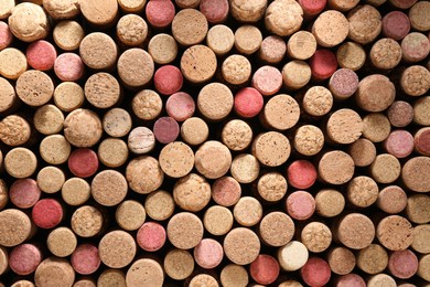 Photo of Many wine bottle corks as background, top view
