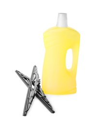 Photo of Bottle of windshield washer fluid and wipers on white background