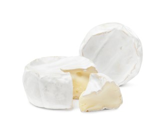 Tasty cut and whole brie cheeses on white background