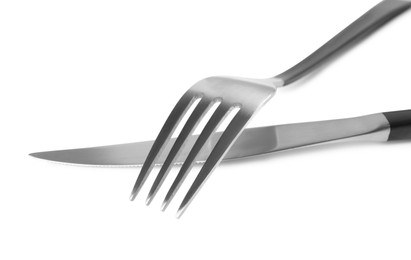 New fork and knife on white background, closeup