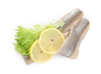 Delicious salted herring fillets with lettuce and lemon slices on white background, top view