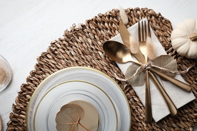 Autumn table setting with pumpkin on white wooden background, flat lay