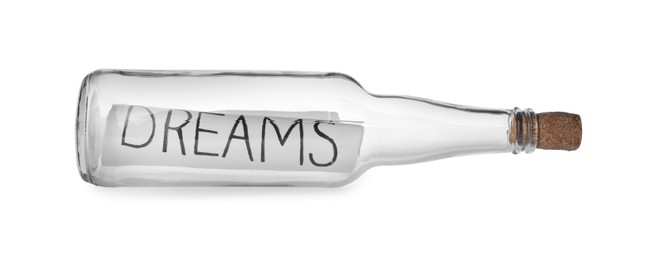 Corked glass bottle with Dreams note on white background