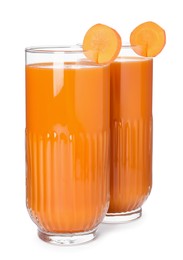 Photo of Two glasses of fresh carrot juice on white background