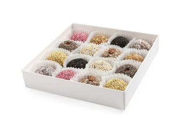 Different delicious vegan candy balls in box on white background