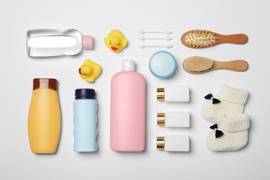 Photo of Flat lay composition with baby cosmetic products on white background