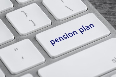 Modern computer keyboard with text Pension Plan on button, closeup view