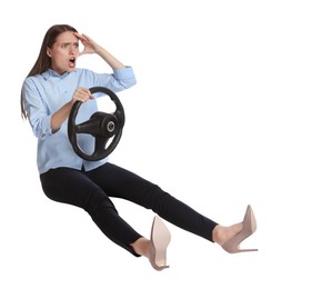 Angry woman with steering wheel against white background