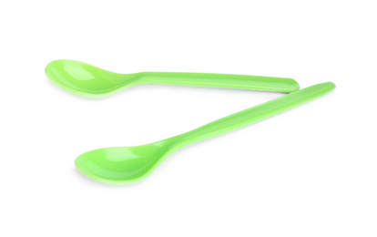Small plastic spoons isolated on white. Serving baby food