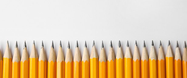 Sharp pencils on white background, top view with space for text. Banner design