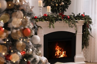 Room with fireplace decorated for Christmas holidays. Interior design