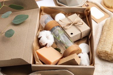 Box with eco friendly personal care products on fabric