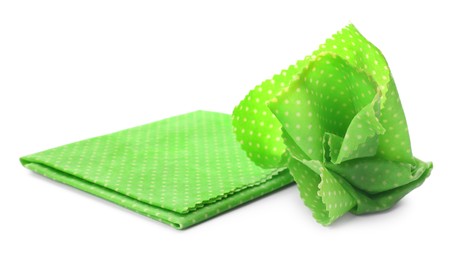 Green reusable beeswax food wraps on white background