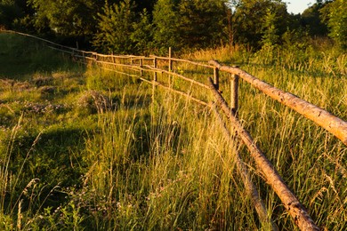 Picturesque view of countryside with wooden fence in morning