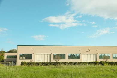 Photo of Exterior of factory building on sunny day