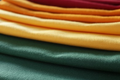 Different colorful kitchen napkins as background, closeup