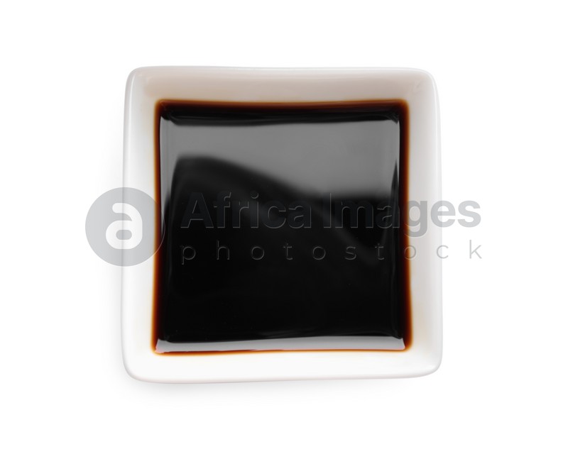 Soy sauce in bowl isolated on white, top view