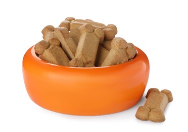 Bone shaped dog cookies and feeding bowl on white background