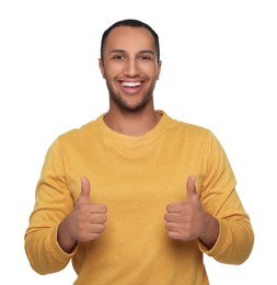 Photo of Smiling African American man showing thumbs up on white background