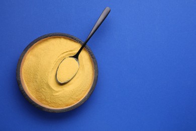 Photo of Beer yeast pills on blue background, top view. Space for text