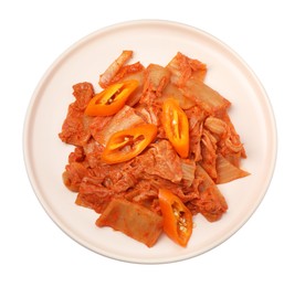Photo of Plate of spicy cabbage kimchi with chili pepper isolated on white, top view