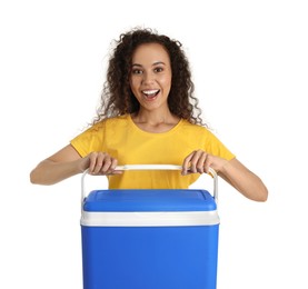 Excited young African American woman with cool box on white background