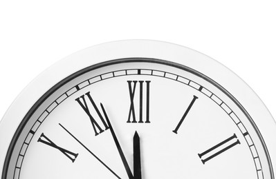 Clock showing five minutes until midnight on white background, closeup. New Year countdown