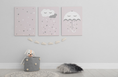 Cute posters on wall in baby room interior