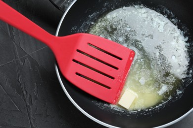 Photo of Melting butter in frying pan, top view