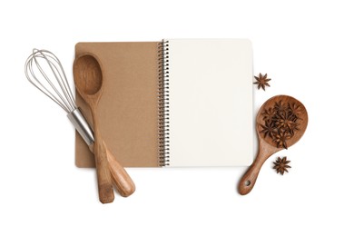 Blank recipe book, anise stars and kitchen utensils on white background, top view. Space for text