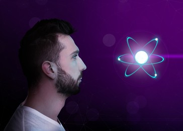 Man and virtual model of atom on color background