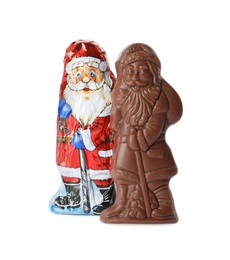 Chocolate Santa Claus candies on white background
