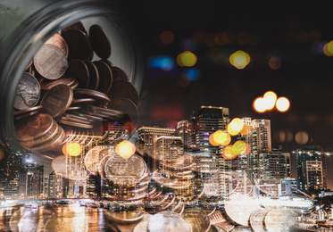 Double exposure of cityscape and US coins. Financial value