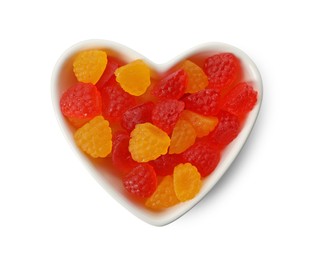 Delicious gummy raspberry candies on white background, top view
