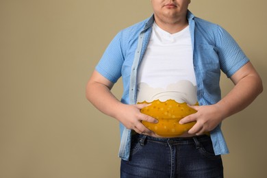 Image of Beer belly problem. Overweight man on beige background, closeup