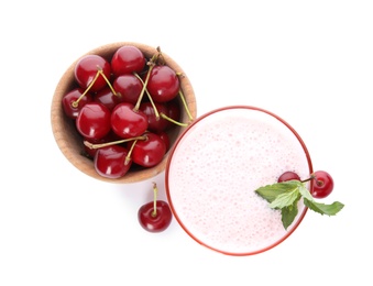 Tasty fresh milk shake with cherries on white background, top view