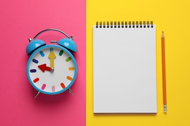 Alarm clock, pencil and blank notebook on color background, flat lay with space for text. Reminder concept