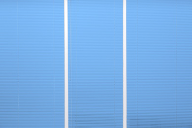 Window with closed blue horizontal blinds as background