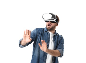 Emotional man using virtual reality headset on white background