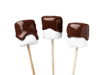 Tasty marshmallows dipped into chocolate on white background