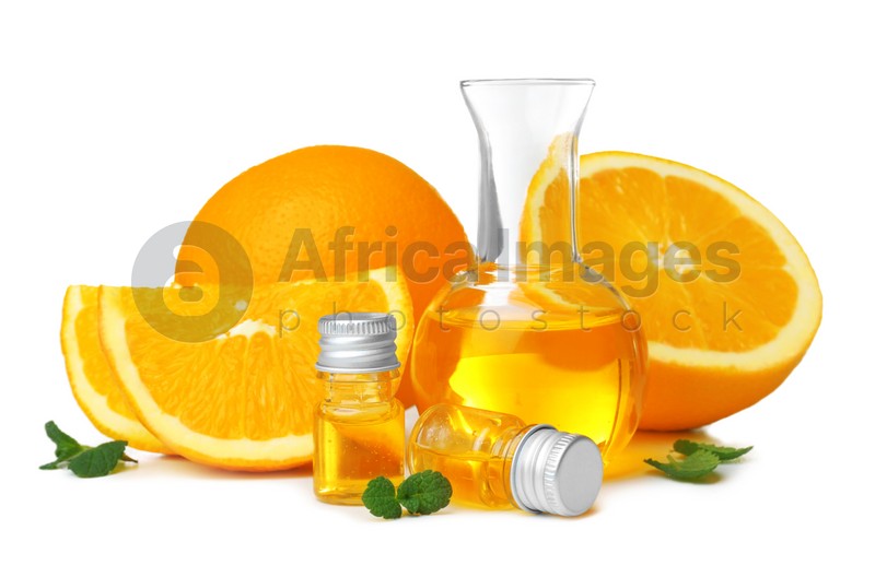 Composition with orange essential oil on white background