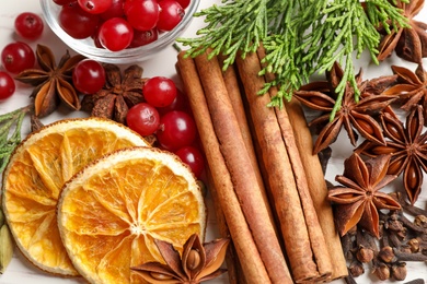 Flat lay composition with mulled wine ingredients on white table
