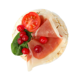 Puffed rice cake with prosciutto, berries and tomato isolated on white, top view
