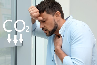 Reduce CO2 emissions. Man suffering from pain during breathing near window