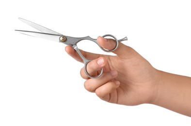 Hairdresser holding professional scissors isolated on white, closeup. Haircut tool