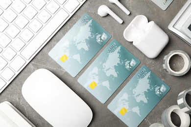 Flat lay composition with credit cards on grey background