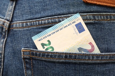 Euro banknote in pocket of jeans, closeup. Spending money