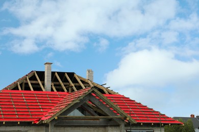 Photo of Roof of house under construction against sky