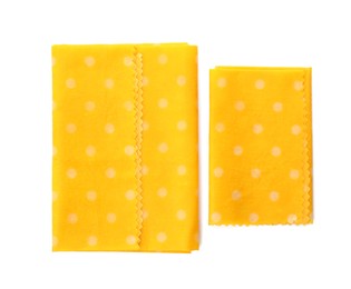 Reusable beeswax food wraps on white background, top view