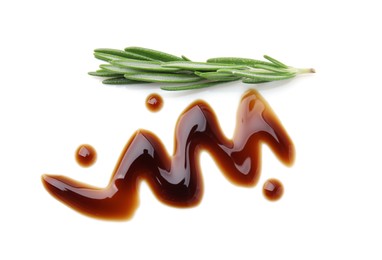 Photo of Balsamic glaze and rosemary on white background, top view